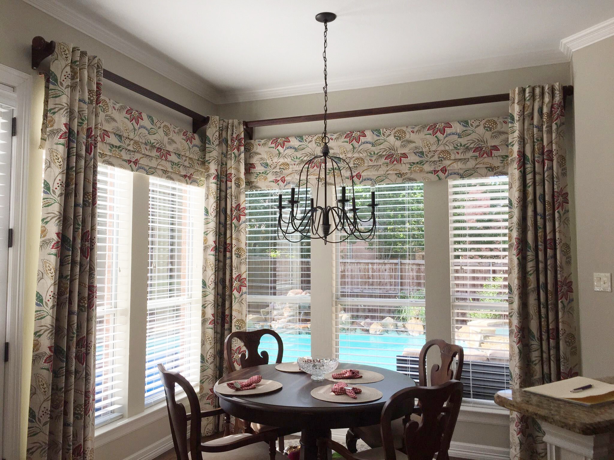 Modern dining area with wood blinds