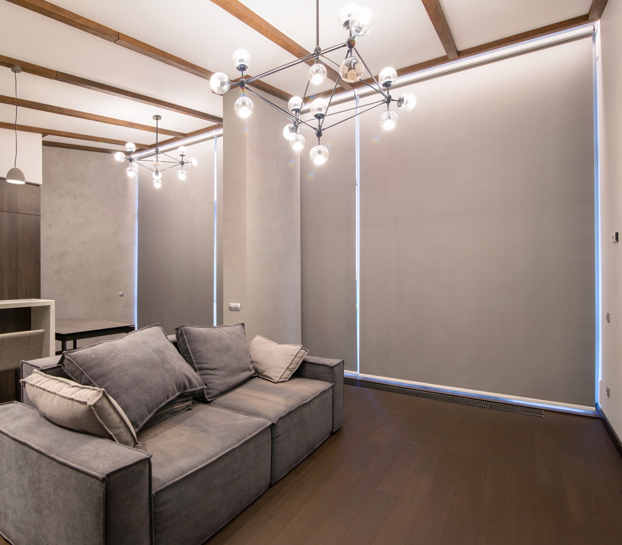 Large custom roller shades in modern living room