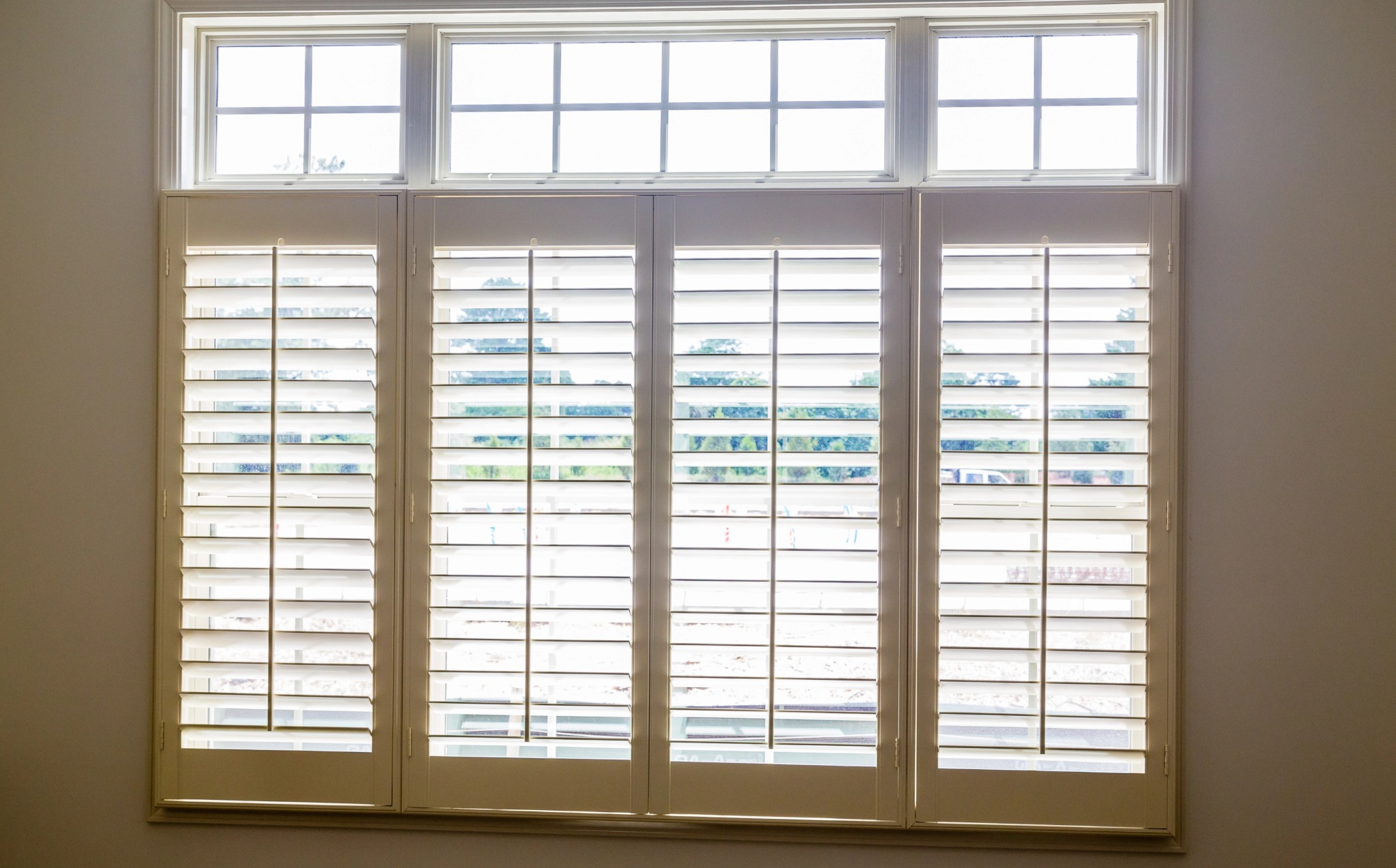 Large white plantation shutters